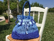 Realizzo borse ed oggeti in fettuccia, stoffa e feltro.